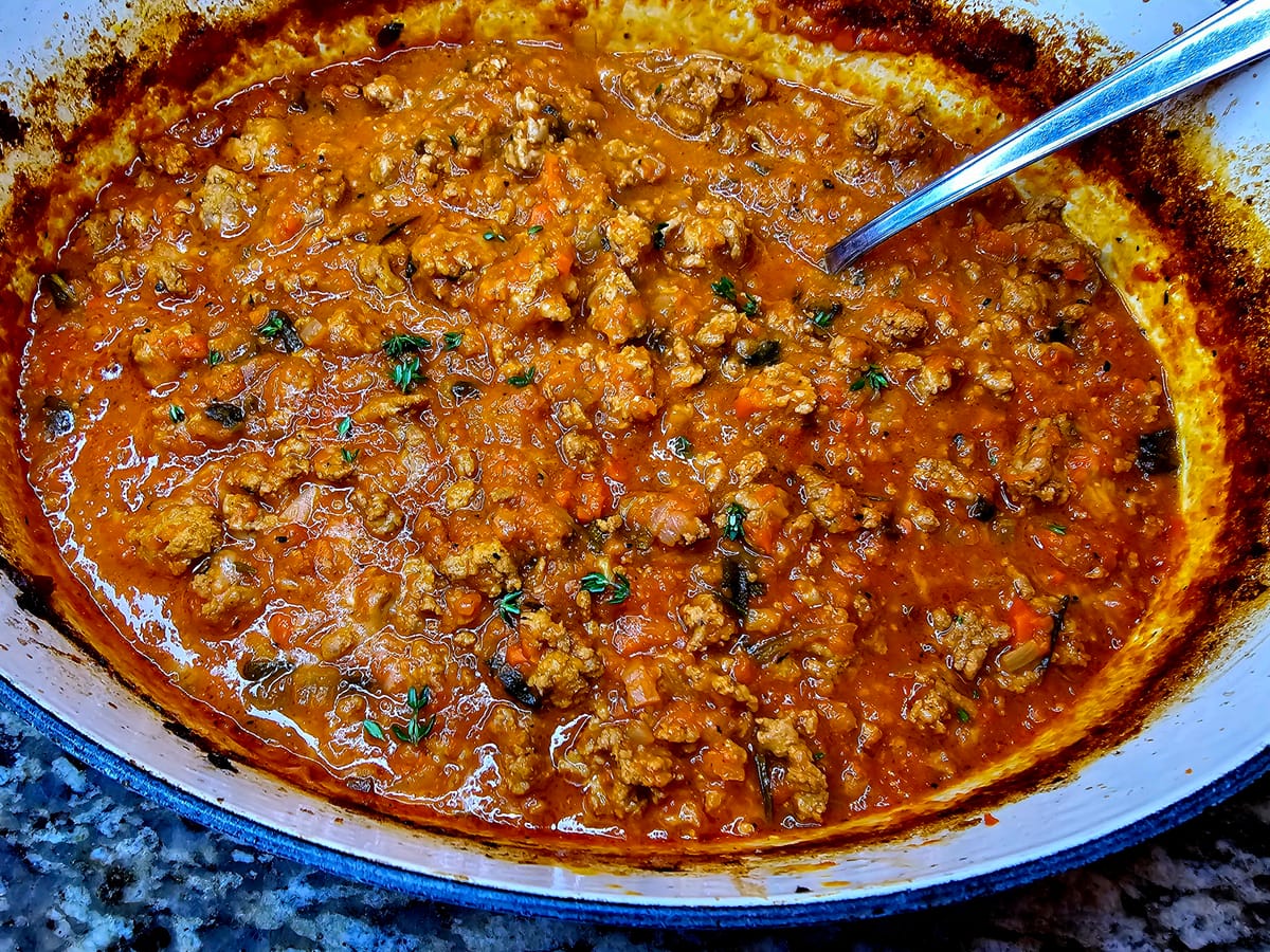 Rich Turkey Bolognese sauce simmered with ground turkey, carrots, celery, and tomato paste served over pasta