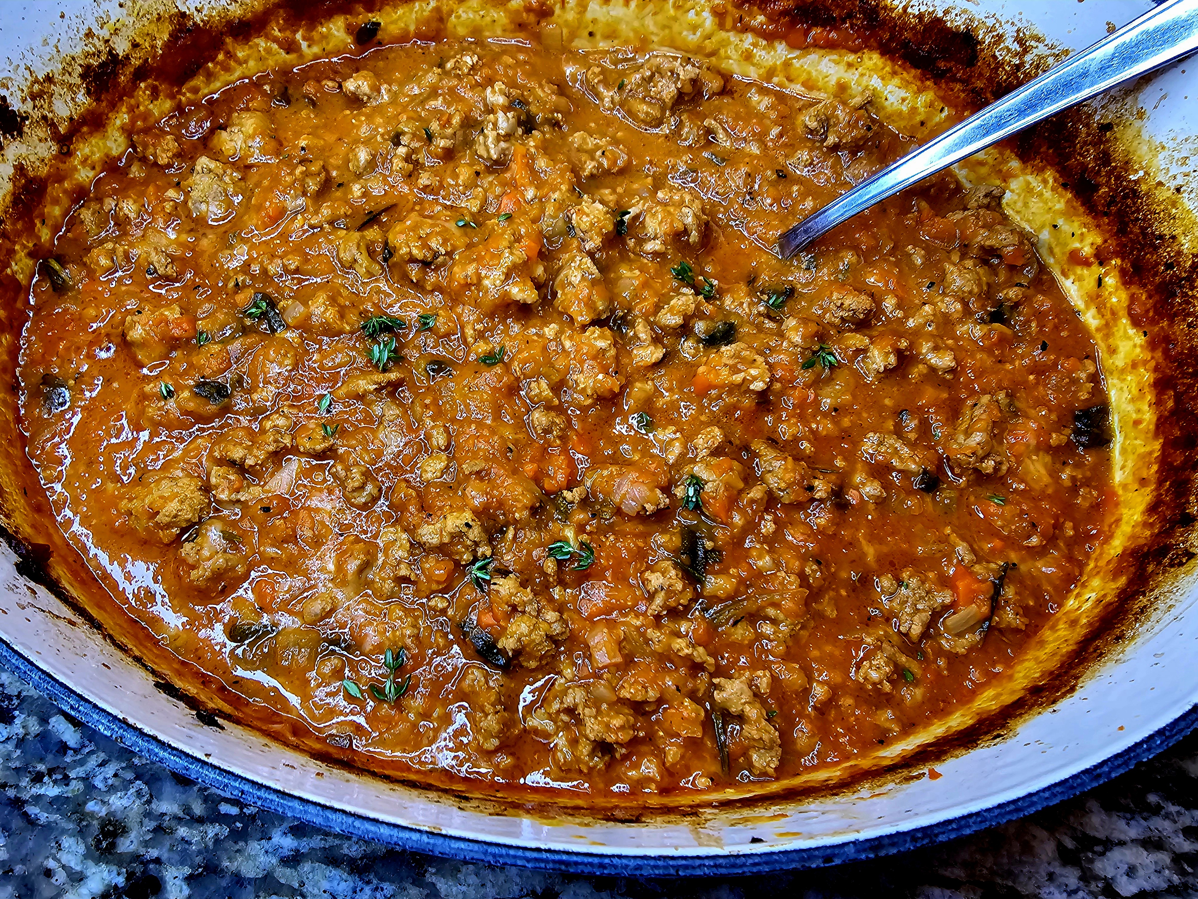 Rich Turkey Bolognese sauce simmered with ground turkey, carrots, celery, and tomato paste served over pasta